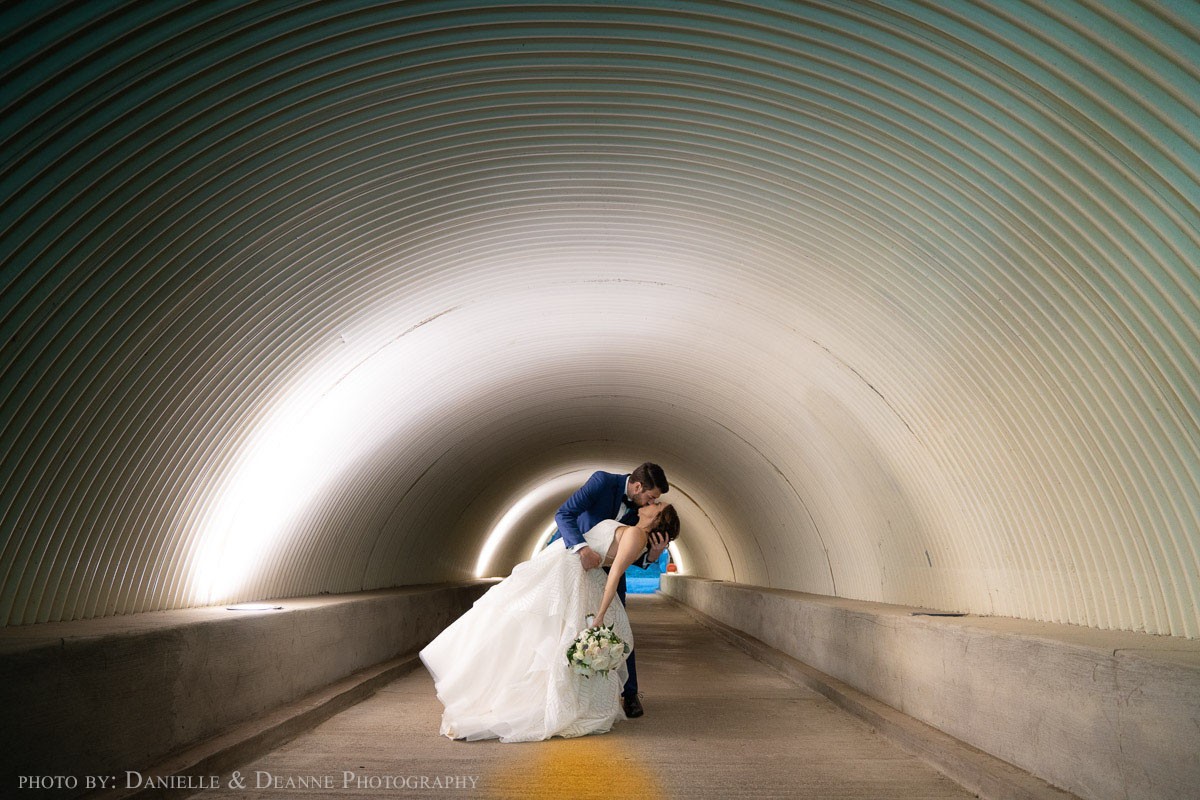 Wedding Couple Kissing in tunnel