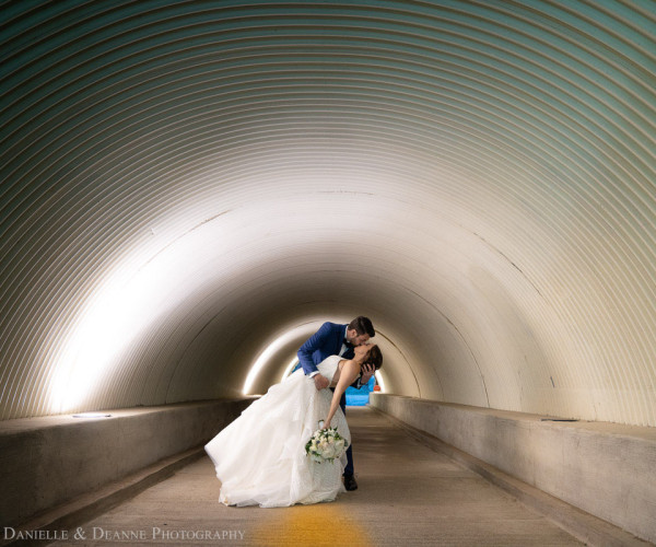 Wedding Couple Kissing in tunnel